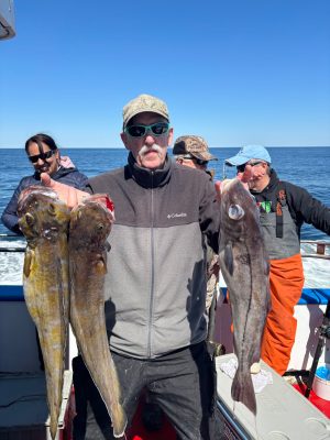 a man holding a fish in the water