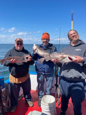 a man and a woman holding a fish