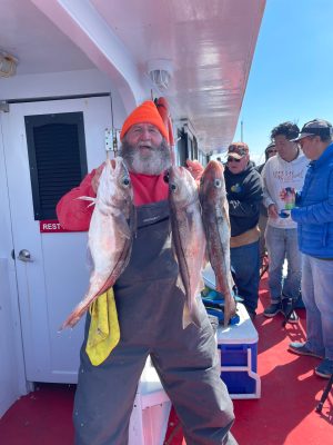 a man holding a fish