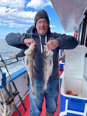 a man holding a fish