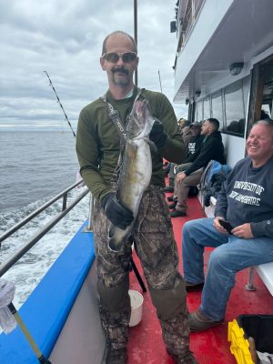 a couple of people that are standing in the snow