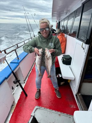 a person standing next to a boat