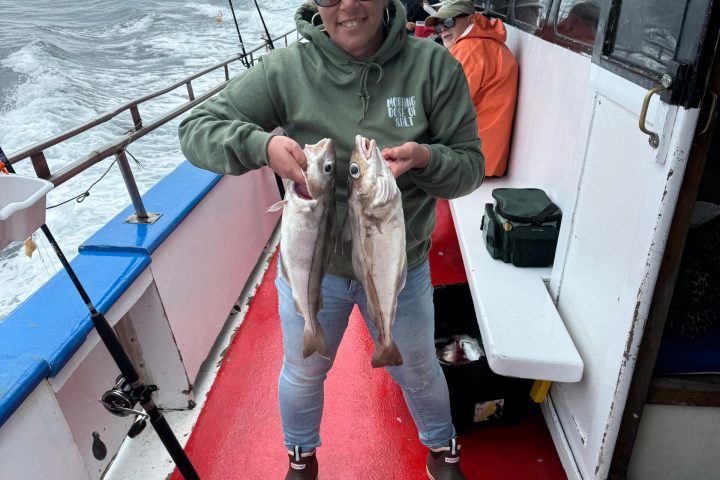 a person standing next to a boat