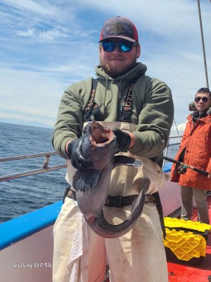 a man standing on a boat in the water