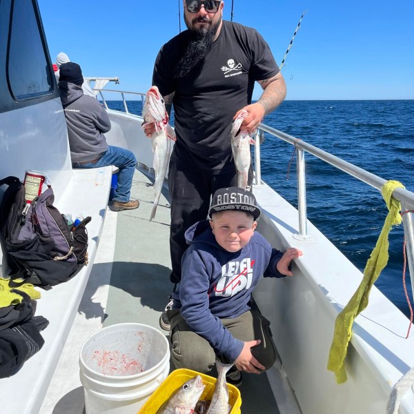 a person riding on the back of a boat