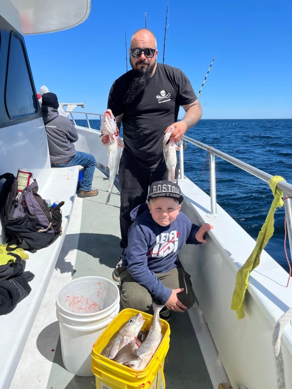 a person riding on the back of a boat