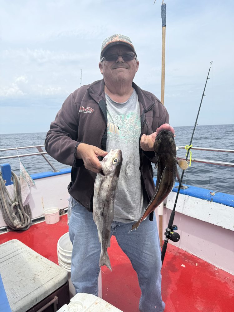 a person holding a fish in the water