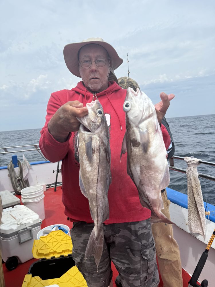 a man holding a fish