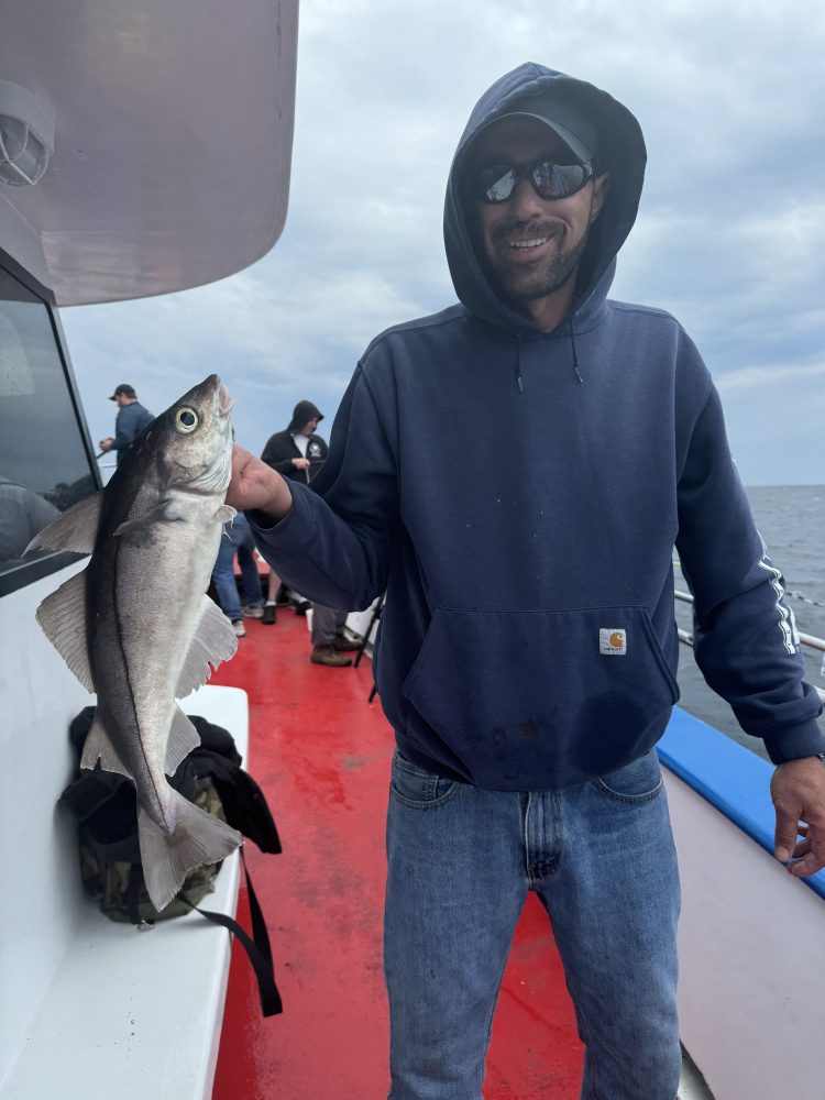 a person holding a fish