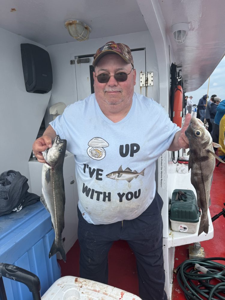 a man holding a fish