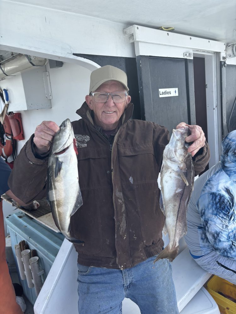 a person holding a fish