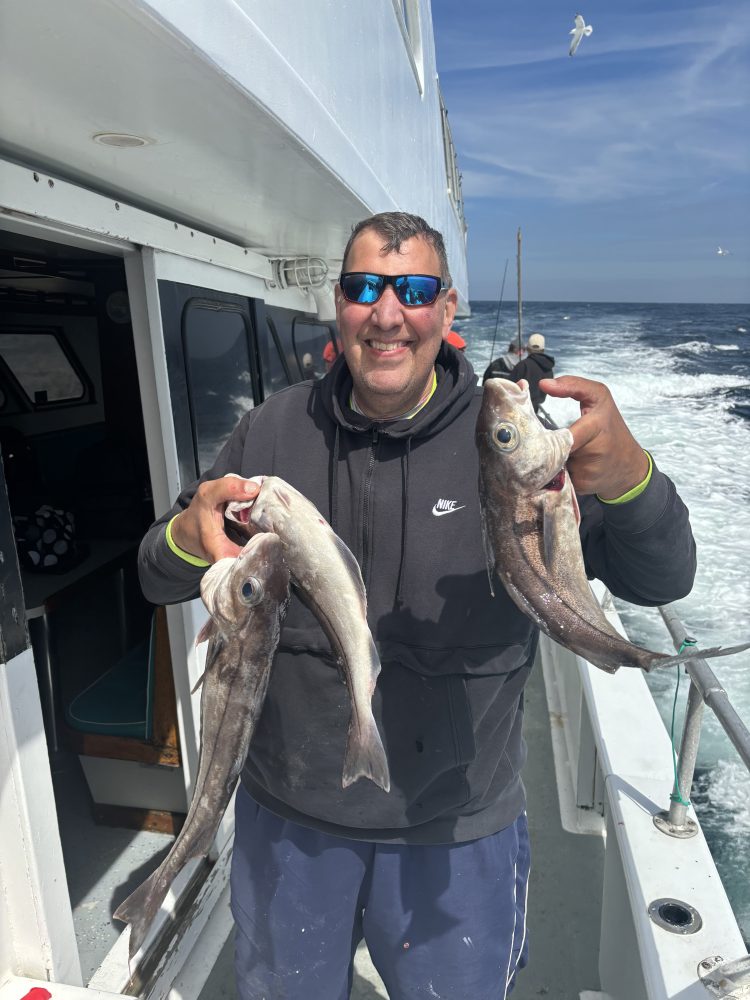 a man holding a fish