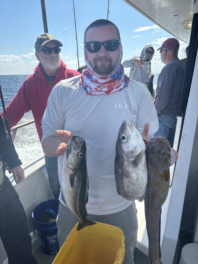 a man holding a fish