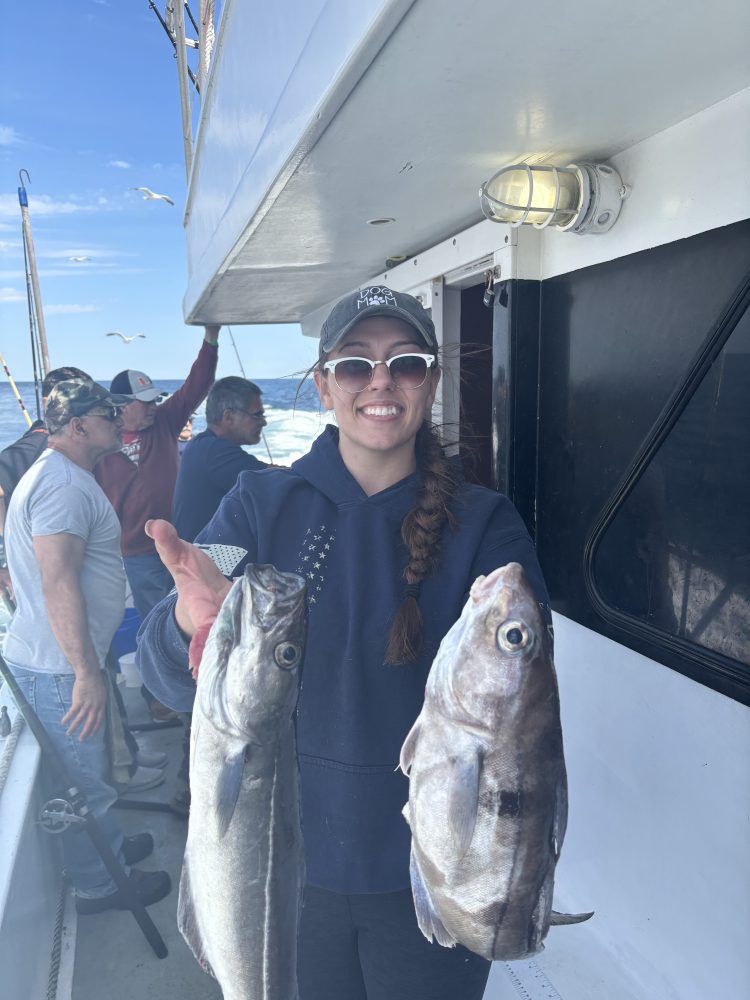 a person holding a fish