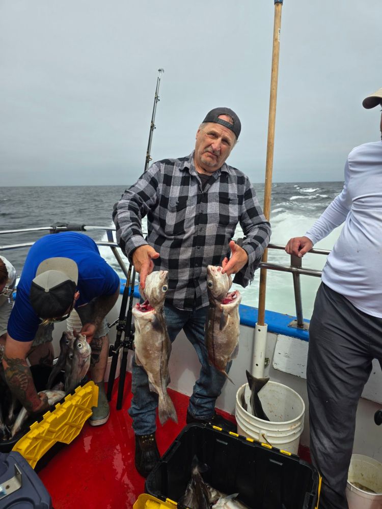 Tom Fleming et al. on a boat