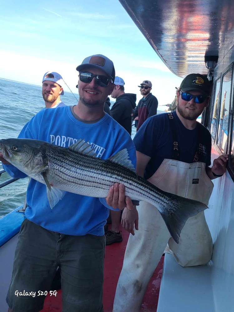 a man holding a fish