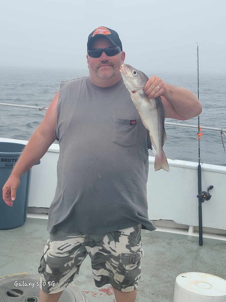 a man holding a fish