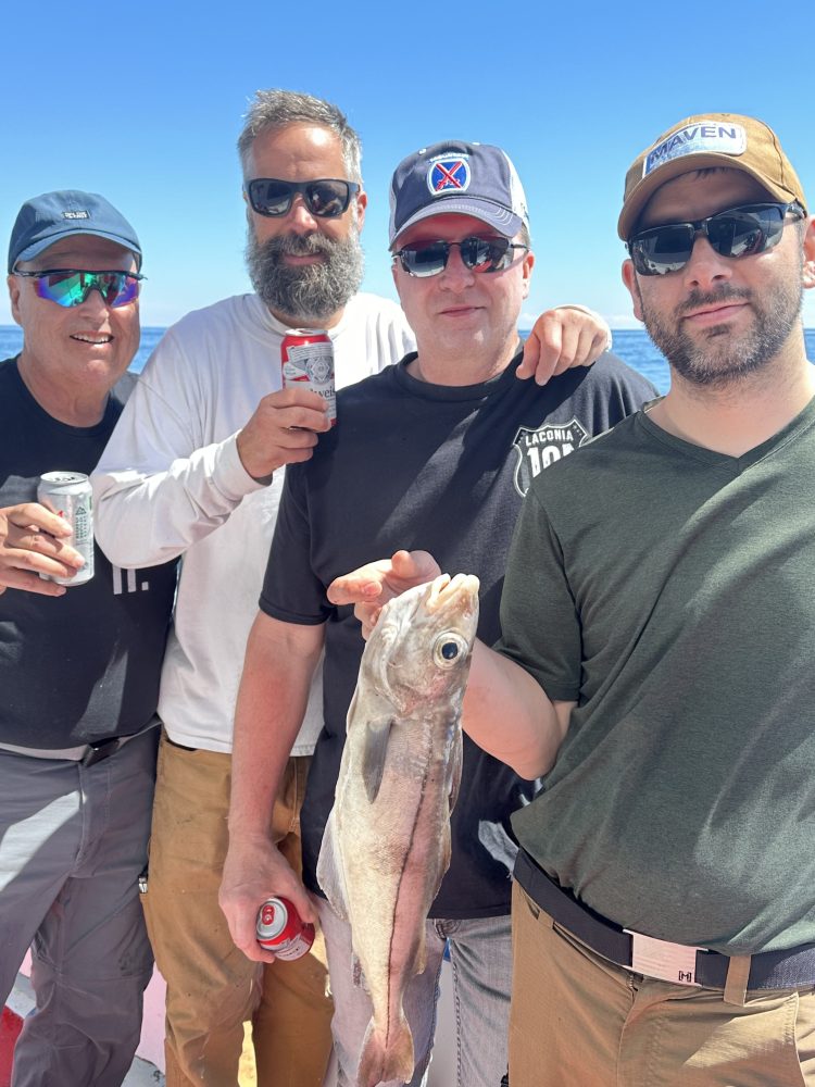 a man holding a fish