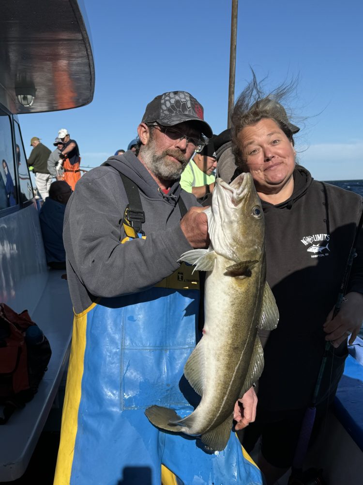 a man holding a fish