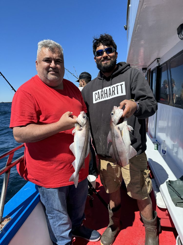 a man holding a fish