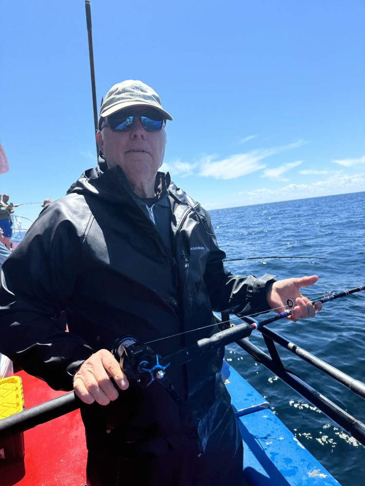 a man rowing a boat in the water