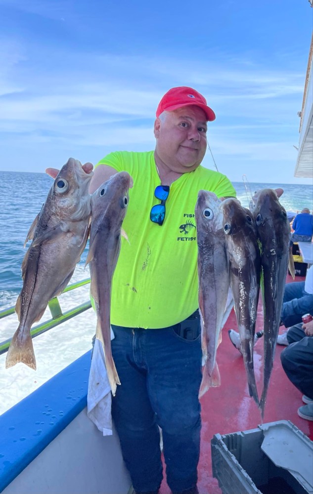 a person holding a fish