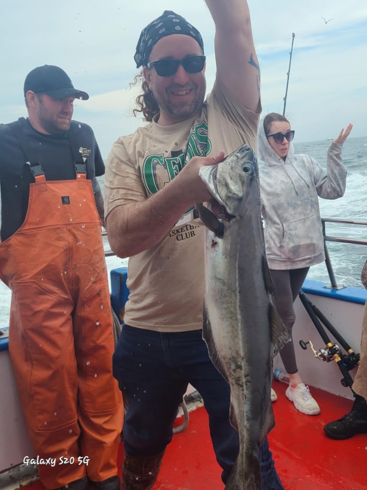 a man holding a fish