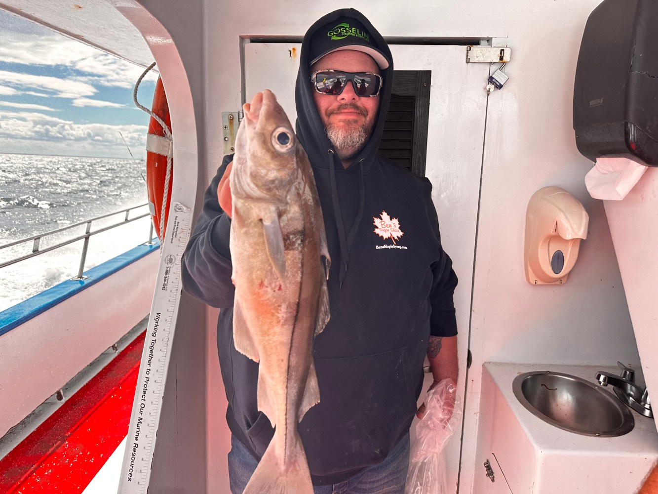 a man holding a fish