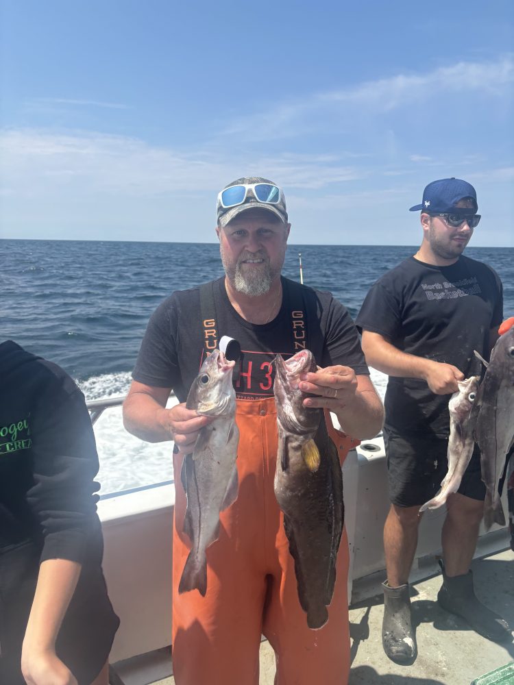 a person holding a fish in the water