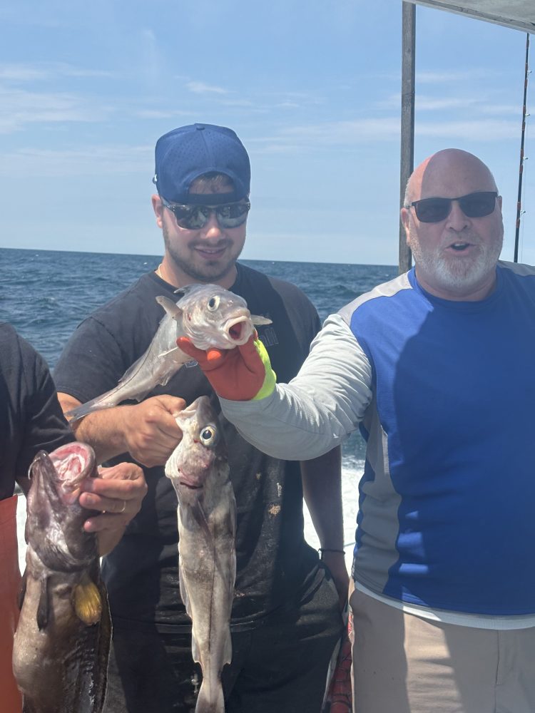 a person holding a fish in the water