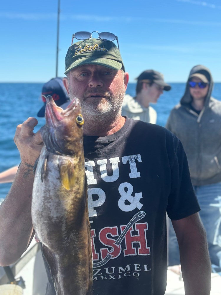 a man holding a fish