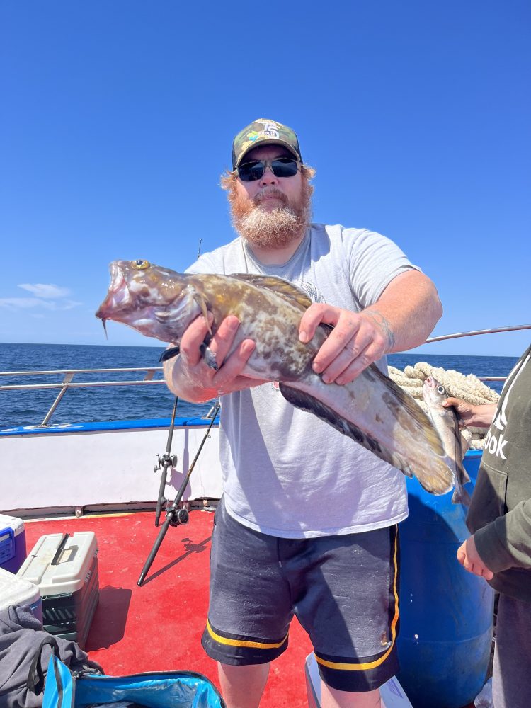 a man holding a fish