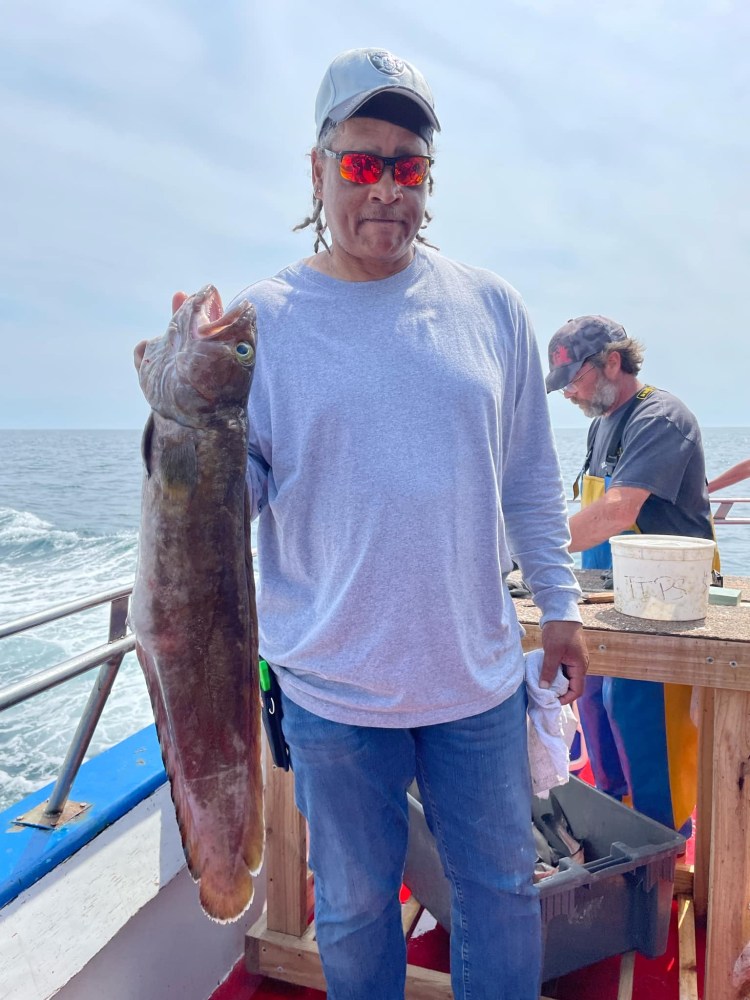 a person holding a fish