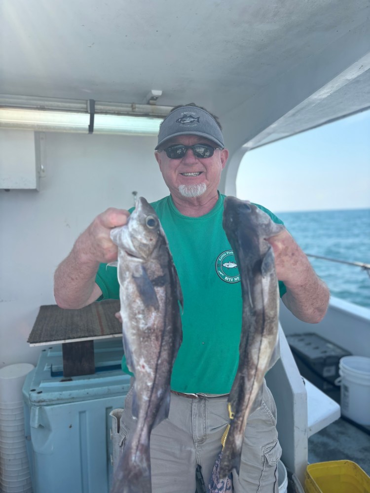 a man holding a fish