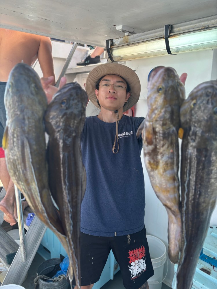 a person holding a fish