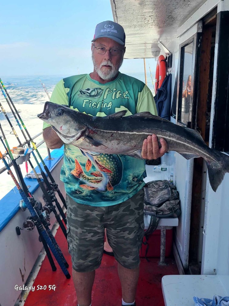 a man holding a fish