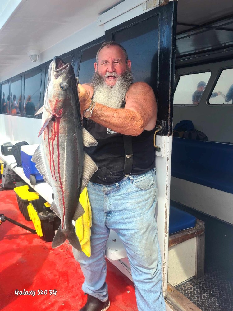 a man holding a fish