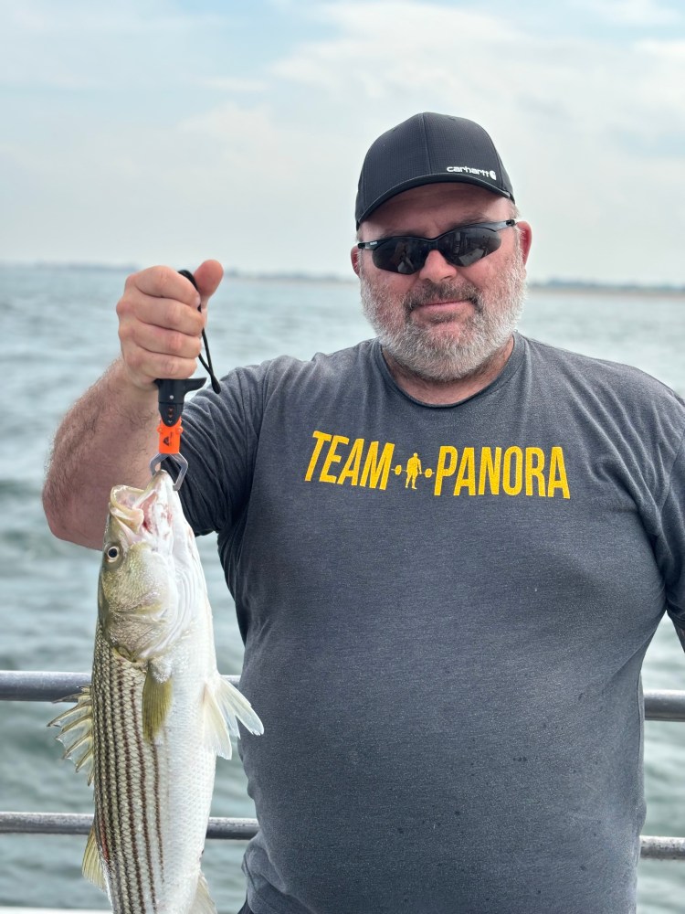 a man holding a fish