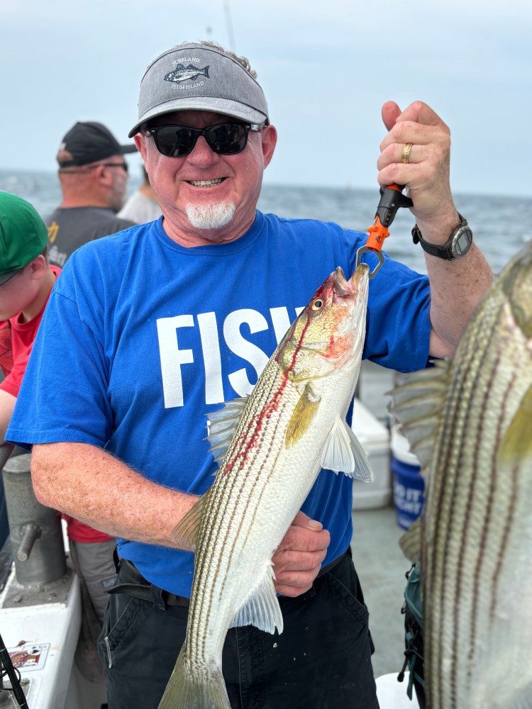 a man holding a fish