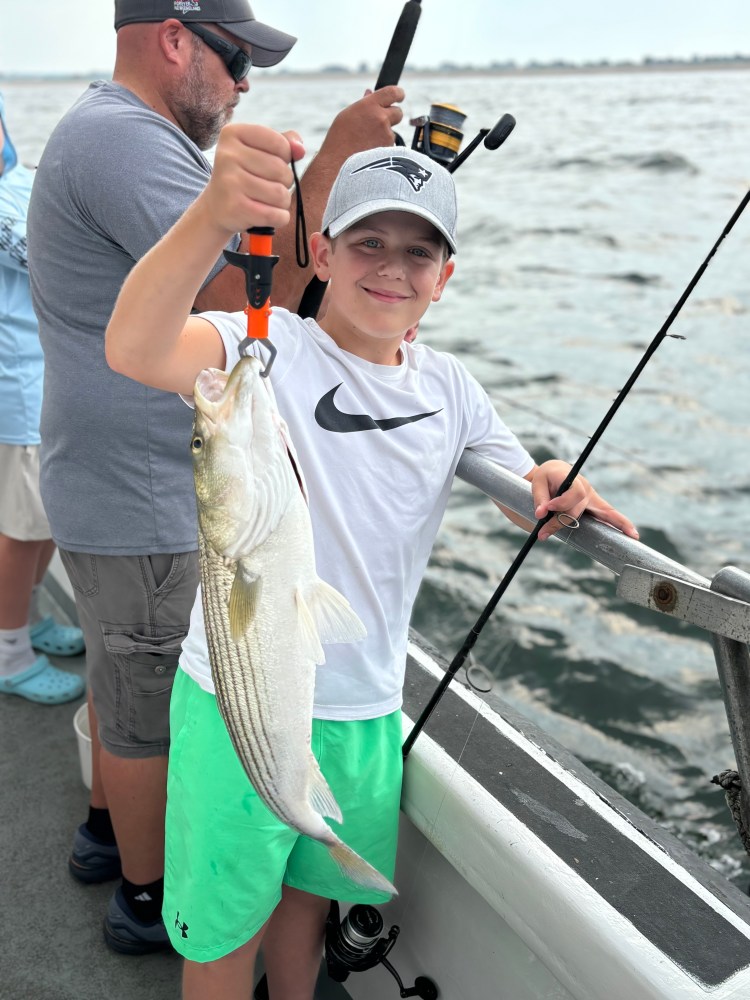 a person holding a fish