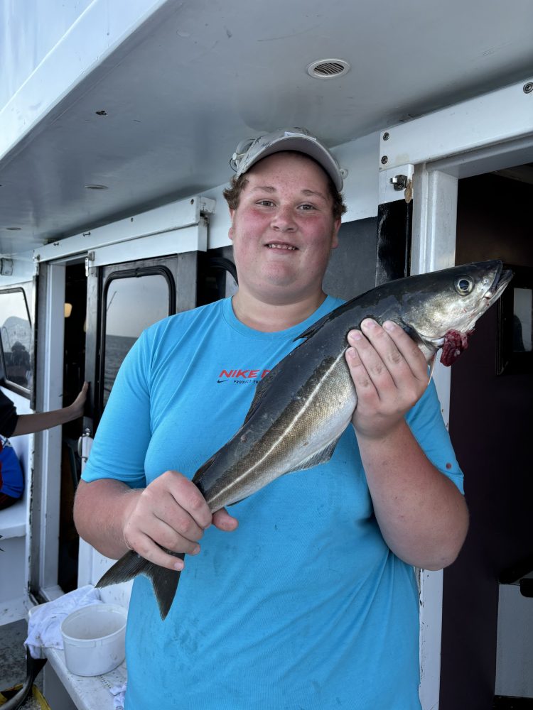 a person holding a fish