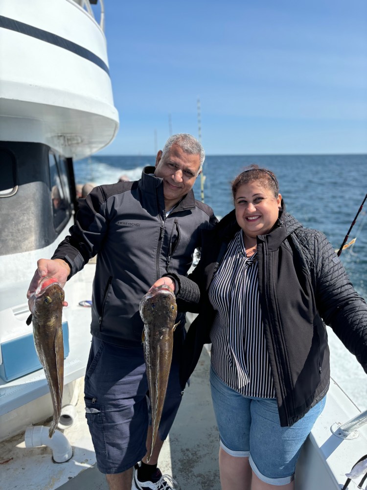 a couple of people that are standing in the water