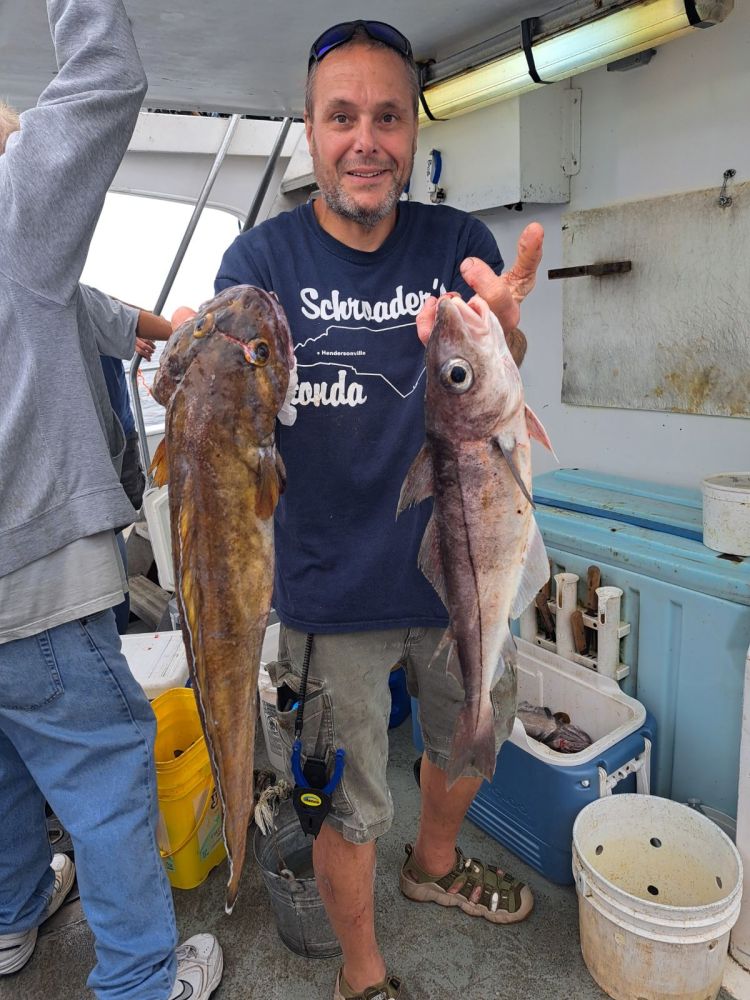 a person holding a fish