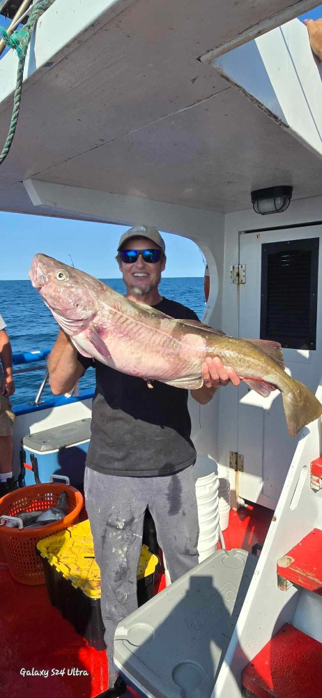 a person holding a fish