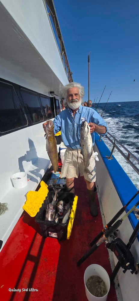 a man standing next to a boat