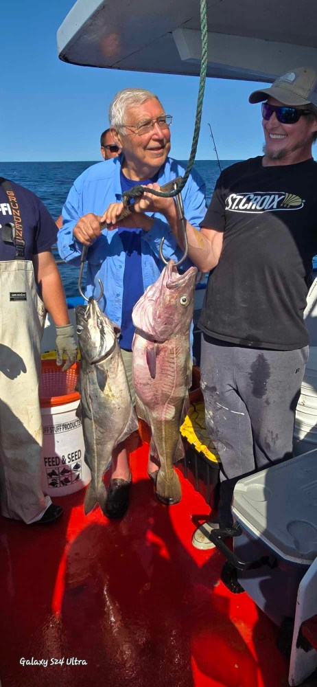 a man holding a fish