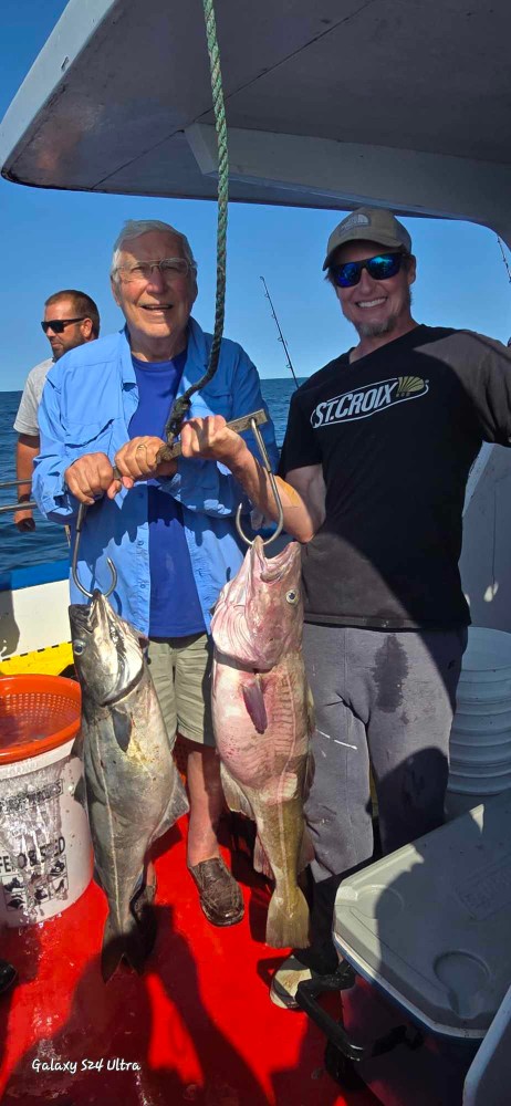 a man holding a fish