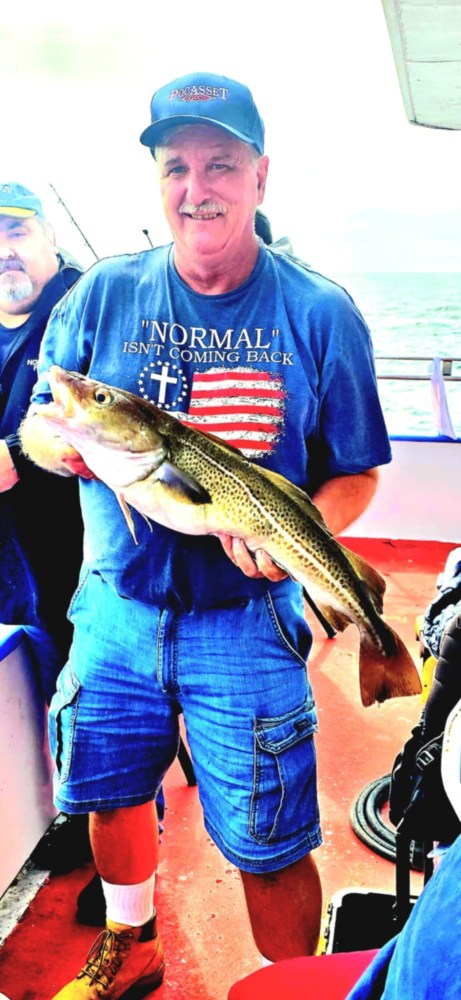 a man holding a fish