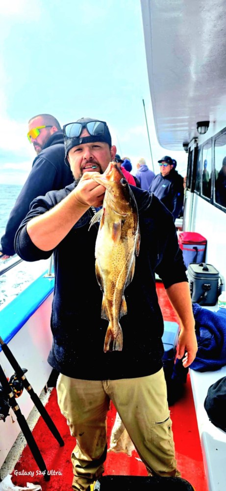 a person holding a fish