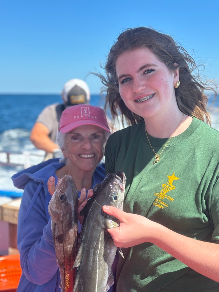 a person holding a fish